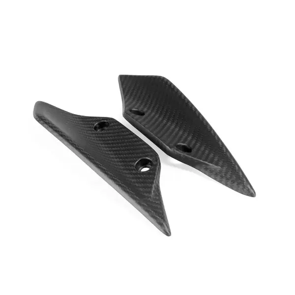 What is the difference in performance between a spoiler and a wing on a sport motorcycle